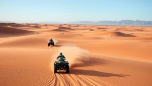 Tourists riding quad bikes through the vast, arid landscapes of Madagascar's Great South Desert with unique rock formations in the background
