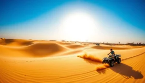 Tourists riding quad bikes across the vast, golden sand dunes of the Sahara Desert in Douz, Tunisia at sunset